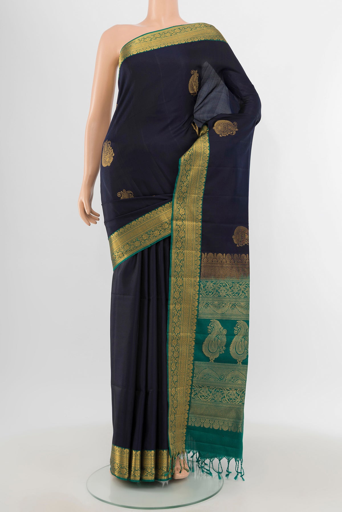 Navy Blue Soft Silk Saree with Zari Butta on the body and Zari Border.  displayed on a mannequin