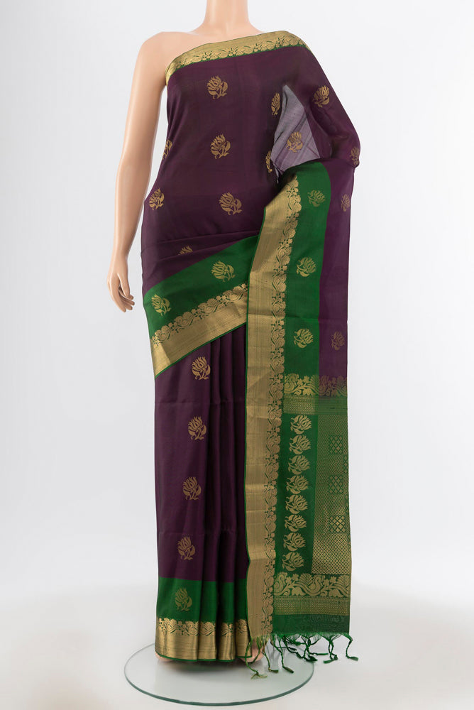 Pure Silk Pure Zari Violet Soft Saree with Zari Butta on the body and Silk Border.  displayed on a mannequin