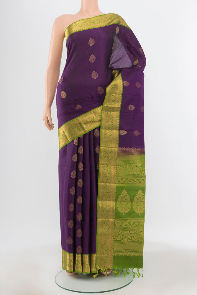 Pure Silk Pure Zari Violet Soft Saree with Zari Butta on the body and Silk Border.  displayed on a mannequin