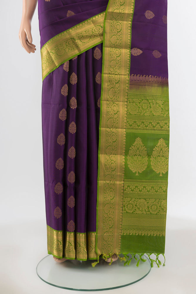 Pleats and pallu of Pure Silk Pure Zari Violet Soft Saree with Zari Butta on the body and Silk Border. 
