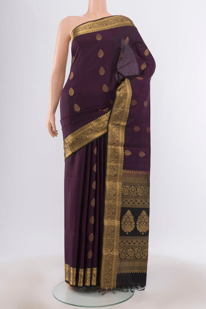 Violet Soft Silk Saree with Zari Butta on the body and Silk Border.  displayed on a mannequin