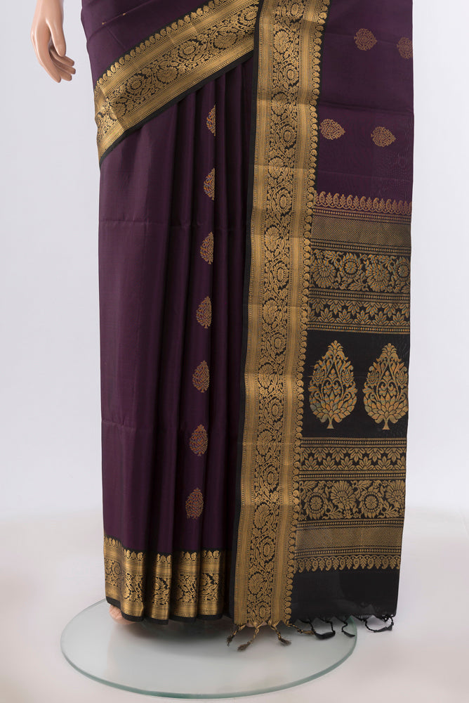 Pleats and pallu of Violet Soft Silk Saree with Zari Butta on the body and Silk Border. 