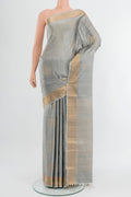 Davys Grey Soft Silk Saree with Zari Butta on the body and Zari Border.  displayed on a mannequin