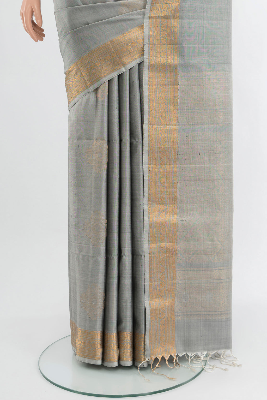 Pleats and pallu of Davys Grey Soft Silk Saree with Zari Butta on the body and Zari Border. 
