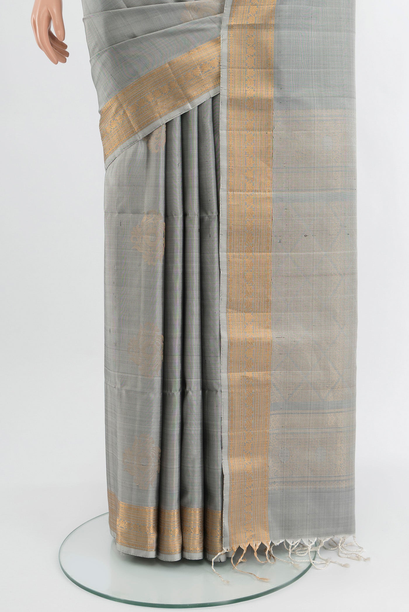 Pleats and pallu of Davys Grey Soft Silk Saree with Zari Butta on the body and Zari Border. 