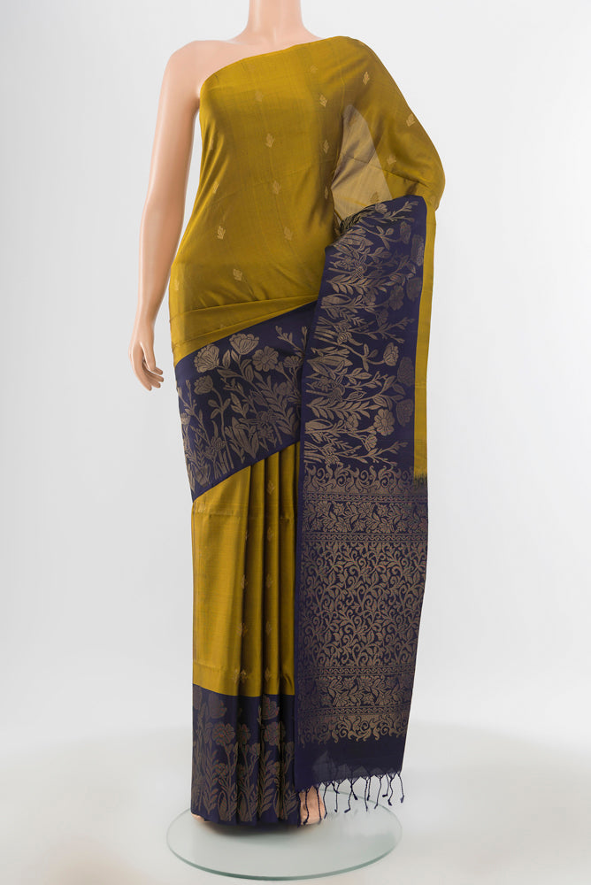 Pure Silk Pure Zari Mehandi Green Soft Saree with Zari Butta on the body and Silk Border.  displayed on a mannequin