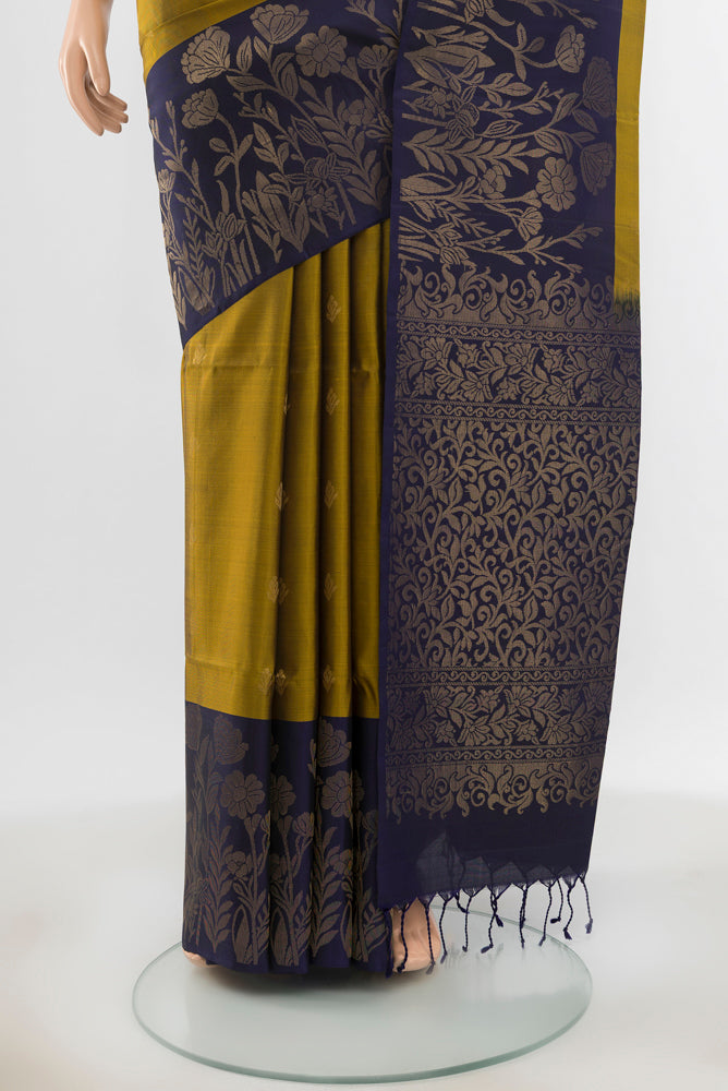 Pleats and pallu of Pure Silk Pure Zari Mehandi Green Soft Saree with Zari Butta on the body and Silk Border. 