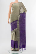 Davys Grey Soft Silk Saree with Zari Butta on the body and Silk Border.  displayed on a mannequin
