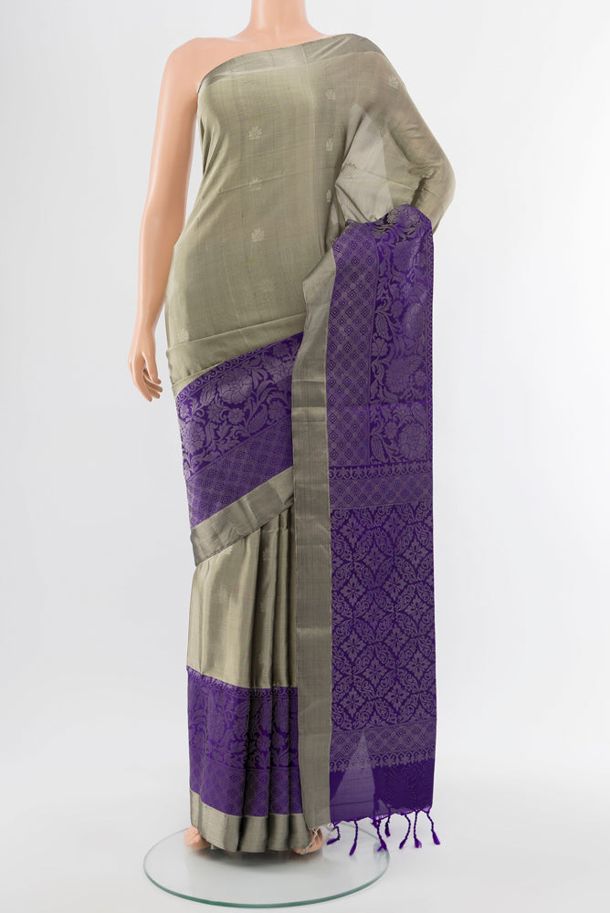 Davys Grey Soft Silk Saree with Zari Butta on the body and Silk Border.  displayed on a mannequin