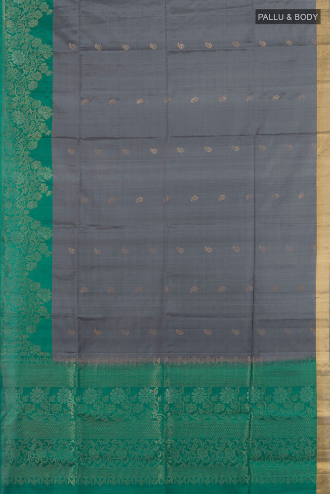 Flat view of Pure Silk Pure Zari Davys Grey Soft Saree with Zari Butta on the body and Silk Border. 