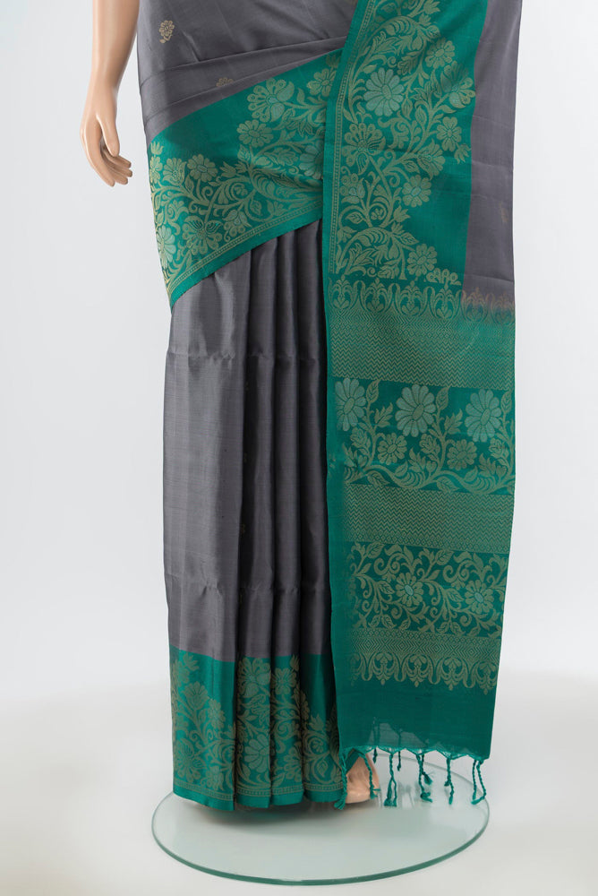 Pleats and pallu of Pure Silk Pure Zari Davys Grey Soft Saree with Zari Butta on the body and Silk Border. 