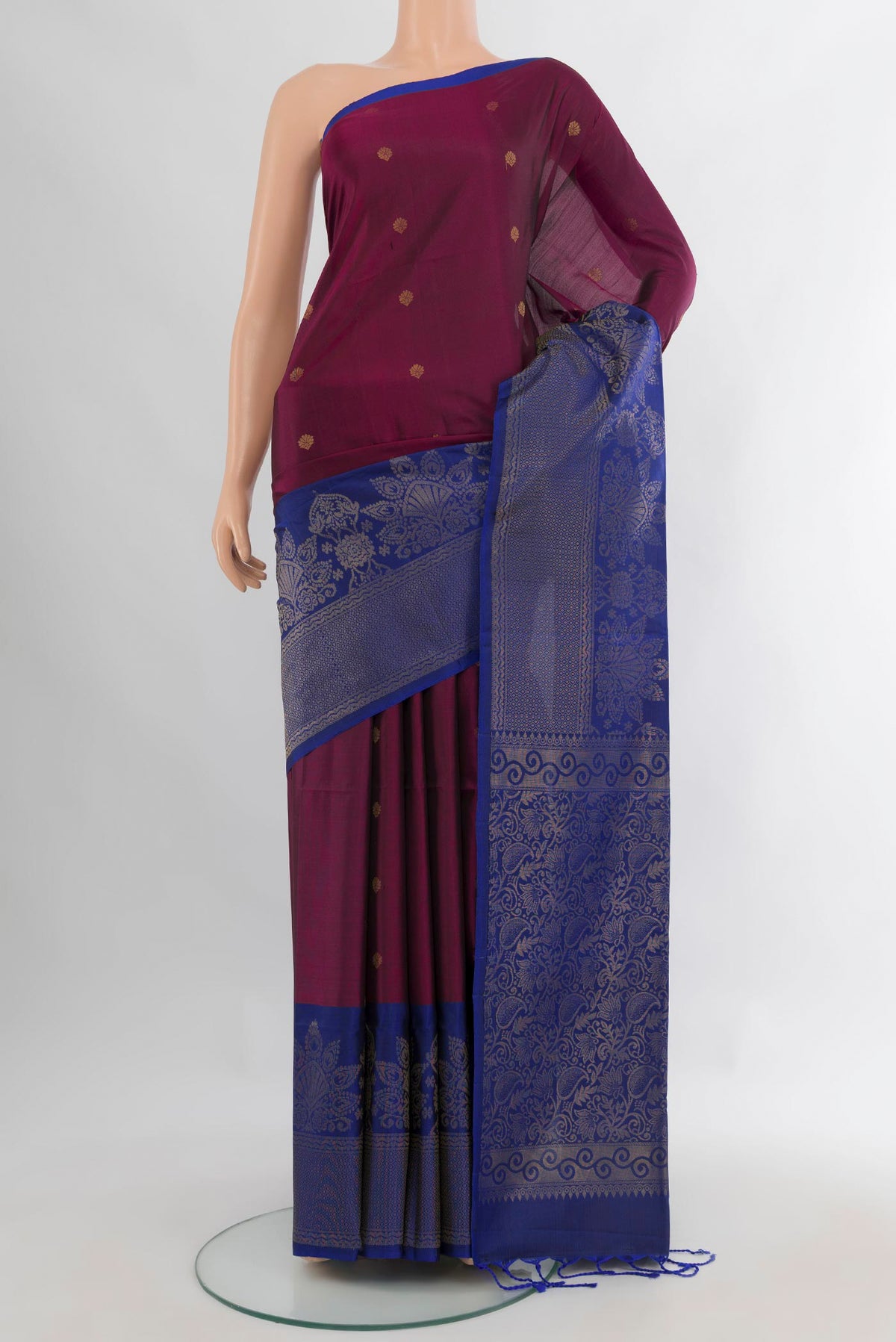 Pure Silk Purple Soft Saree with Zari Butta on the body and Fancy Border.  displayed on a mannequin