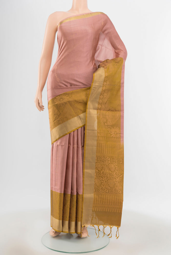 Pure Silk Pure Zari Bronze Soft Saree with Zari Butta on the body and Silk Border.  displayed on a mannequin