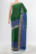 Pure Silk Pure Zari Bottle Green Soft Saree with Zari Butta on the body and Silk Border.  displayed on a mannequin