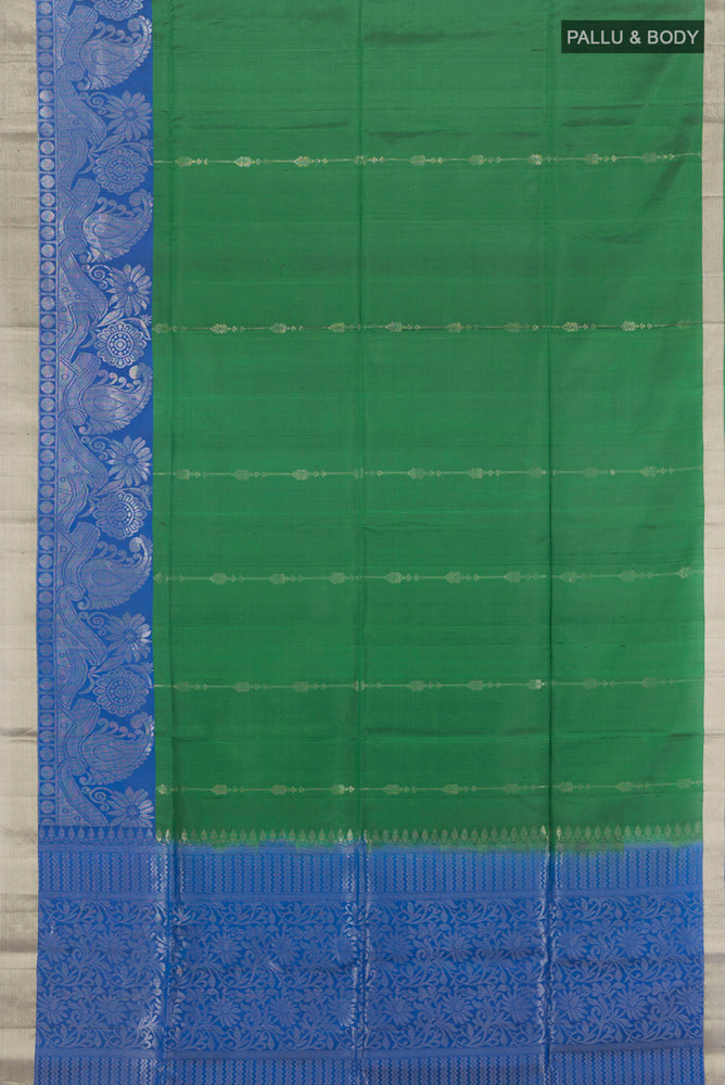 Flat view of Pure Silk Pure Zari Bottle Green Soft Saree with Zari Butta on the body and Silk Border. 