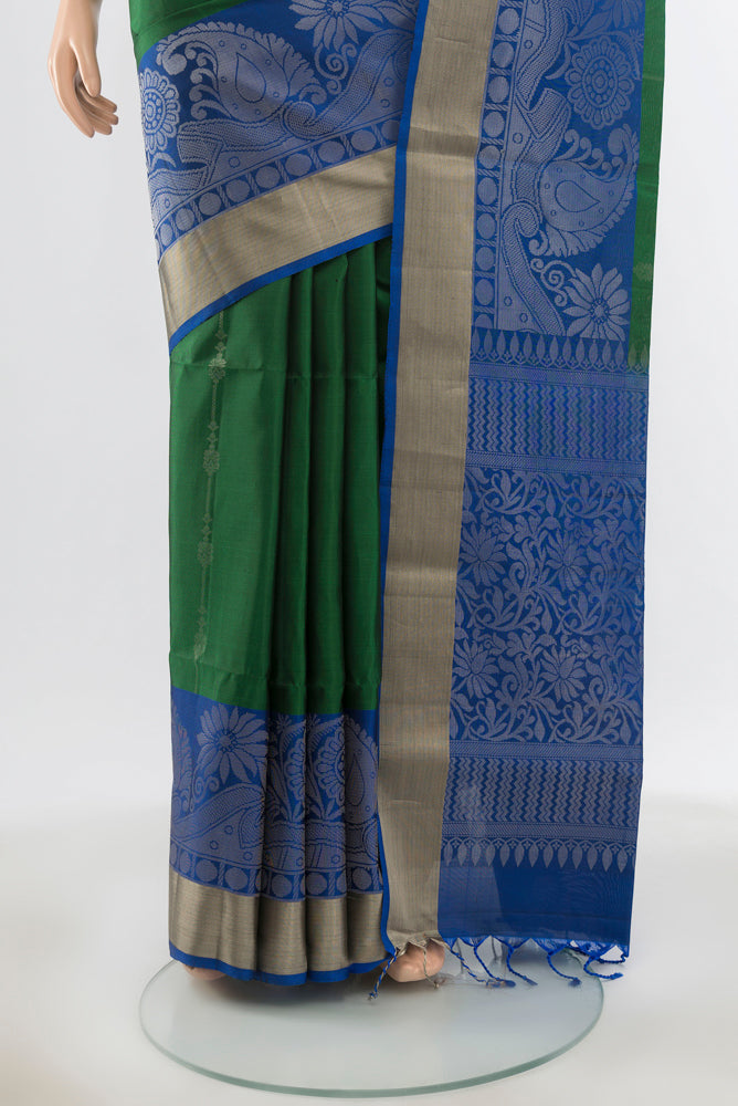 Pleats and pallu of Pure Silk Pure Zari Bottle Green Soft Saree with Zari Butta on the body and Silk Border. 