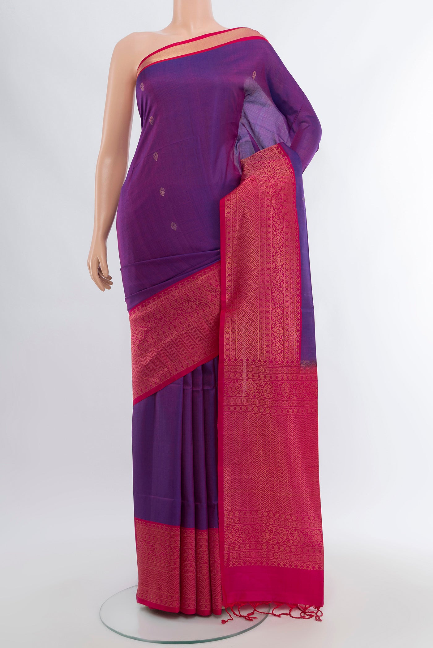 Violet Soft Silk Saree with Zari Butta on the body and Silk Border.  displayed on a mannequin