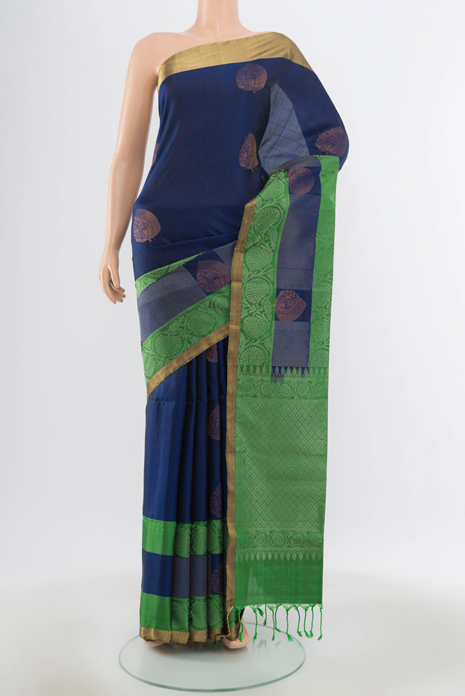 Pure Silk Pure Zari Navy Blue Soft Saree with Zari Butta on the body and Silk Border.  displayed on a mannequin