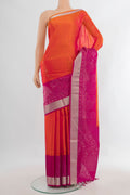 Pure Silk Orange Soft Saree with Zari Butta on the body and Fancy Border.  displayed on a mannequin