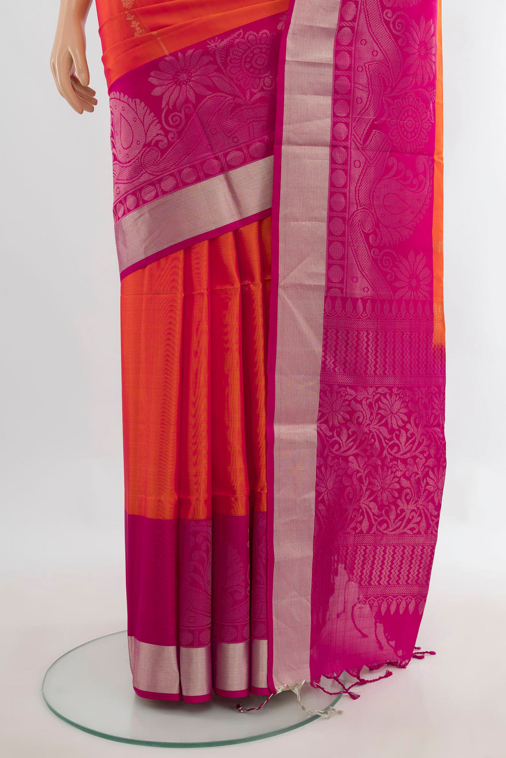Pleats and pallu of Pure Silk Orange Soft Saree with Zari Butta on the body and Fancy Border. 