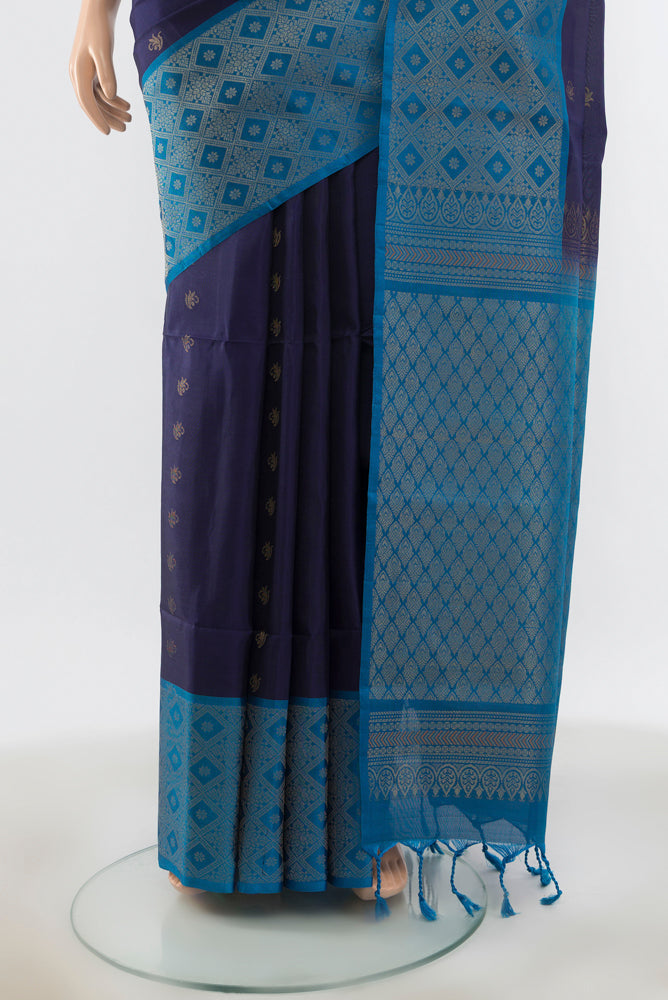 Pleats and pallu of Navy Blue Soft Silk Saree with Zari Butta on the body and Silk Border. 