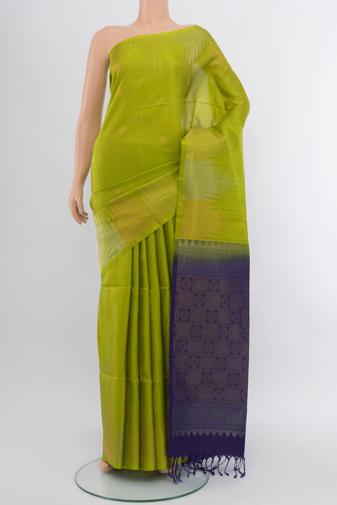 Parrot Green Soft Silk Saree with Zari Butta on the body and Silk Border.  displayed on a mannequin