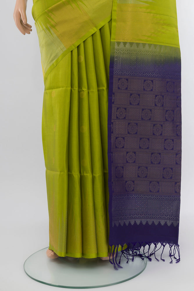 Pleats and pallu of Parrot Green Soft Silk Saree with Zari Butta on the body and Silk Border. 