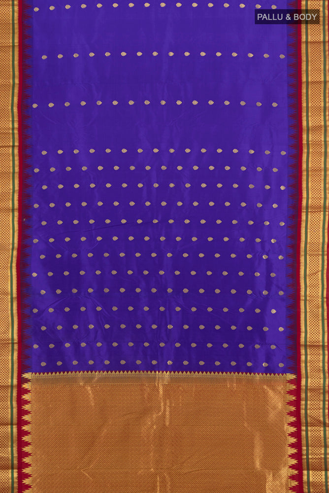 Flat view of Pure Silk Pure Zari Dark Blue Kanchipuram Saree with Zari Butta on the body and Silk Border. 