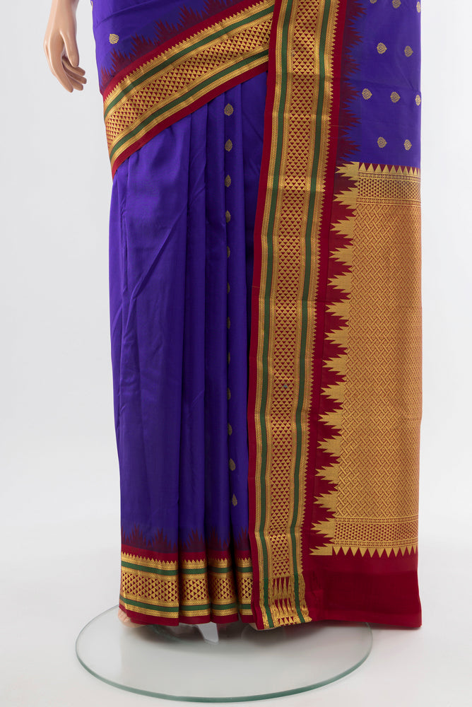 Pleats and pallu of Pure Silk Pure Zari Dark Blue Kanchipuram Saree with Zari Butta on the body and Silk Border. 