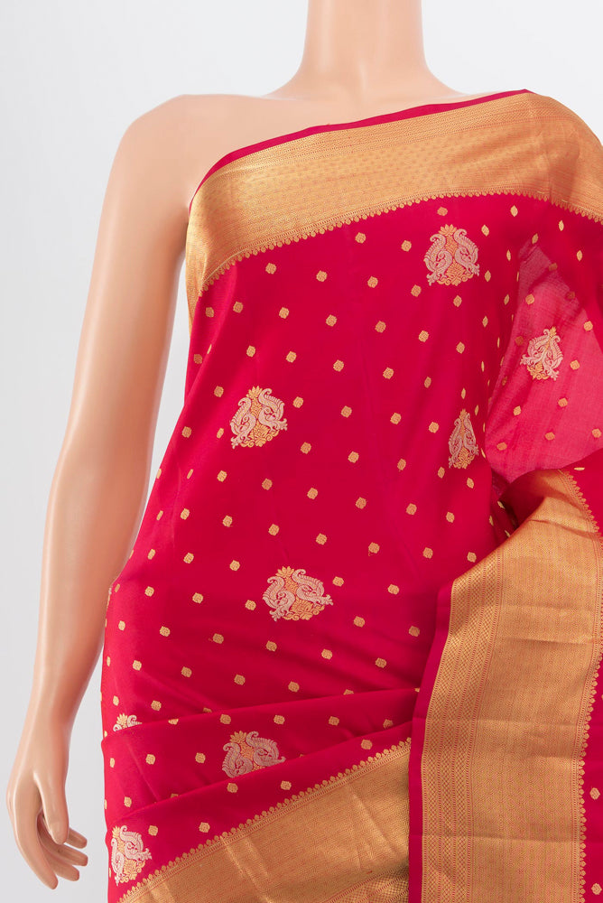 Border image of Pure Silk Pure Zari Dark Pink Kanchipuram Saree with Zari Butta on the body and Silk Border. 