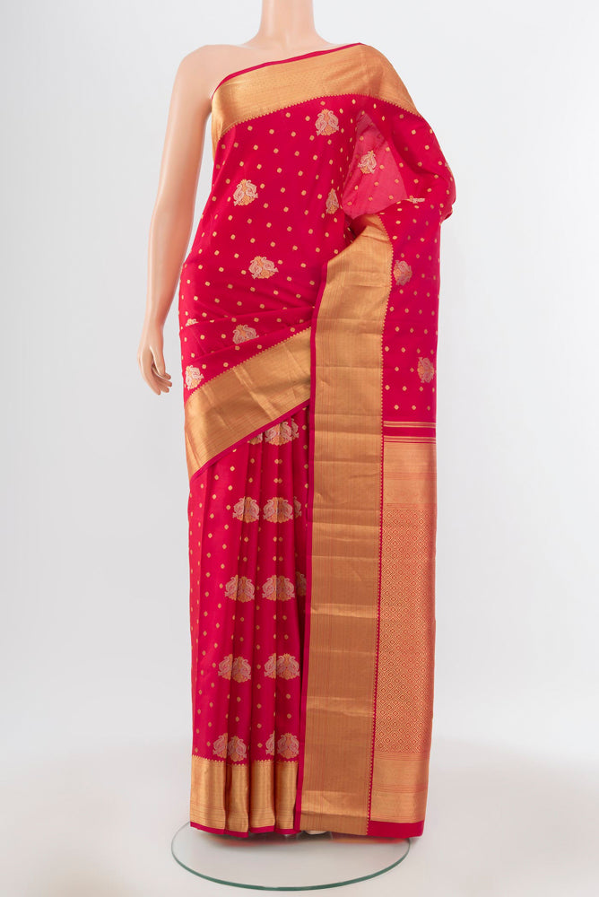 Pure Silk Pure Zari Dark Pink Kanchipuram Saree with Zari Butta on the body and Silk Border.  displayed on a mannequin
