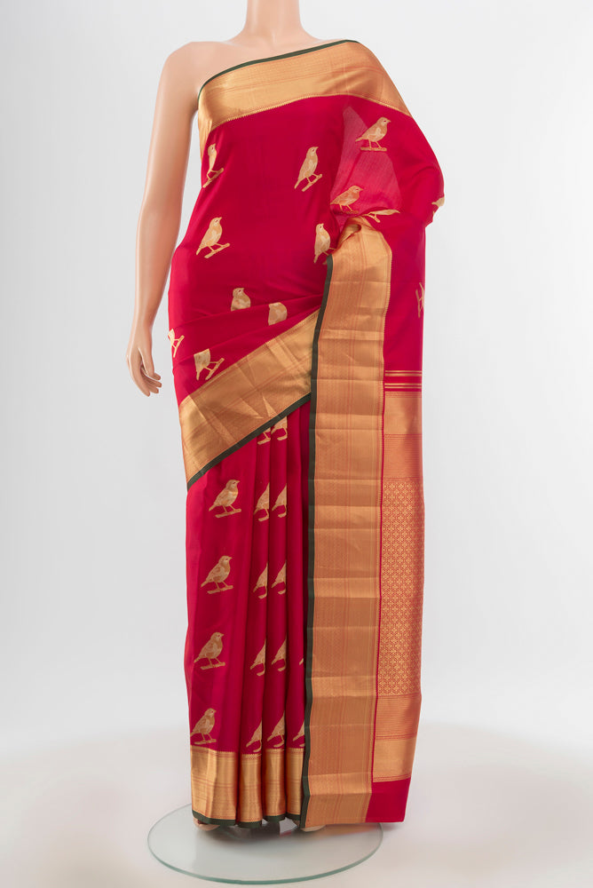 Pure Silk Pure Zari Peach Kanchipuram Saree with Zari Butta on the body and Silk Border.  displayed on a mannequin