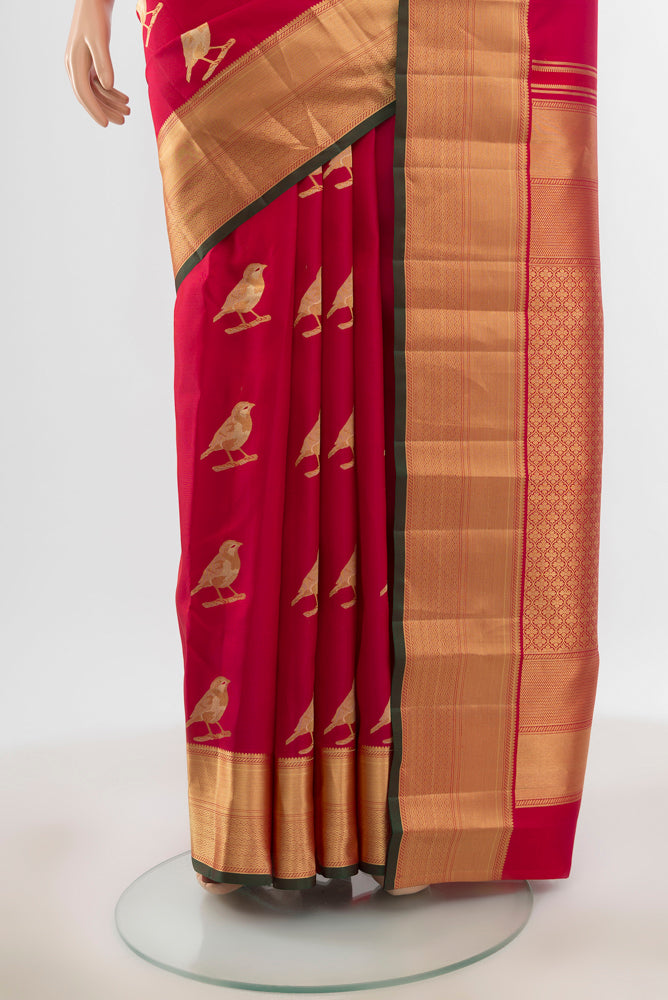 Pleats and pallu of Pure Silk Pure Zari Peach Kanchipuram Saree with Zari Butta on the body and Silk Border. 