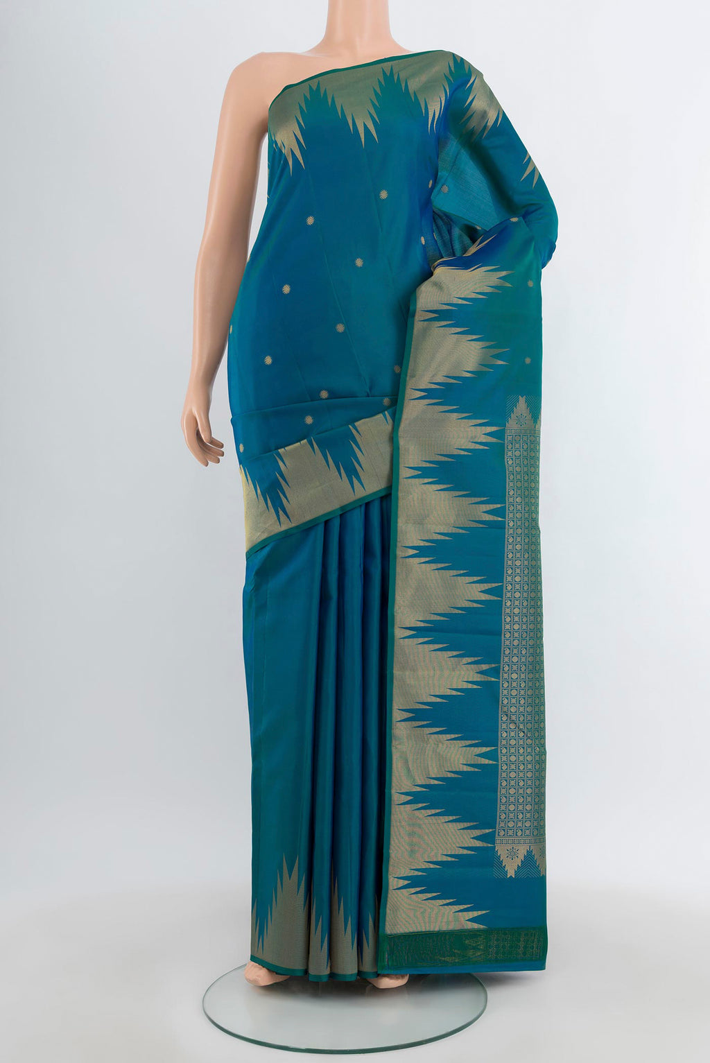 Peacock Blue Kanchipuram Silk Saree with Zari Butta on the body and Temple Border.  displayed on a mannequin