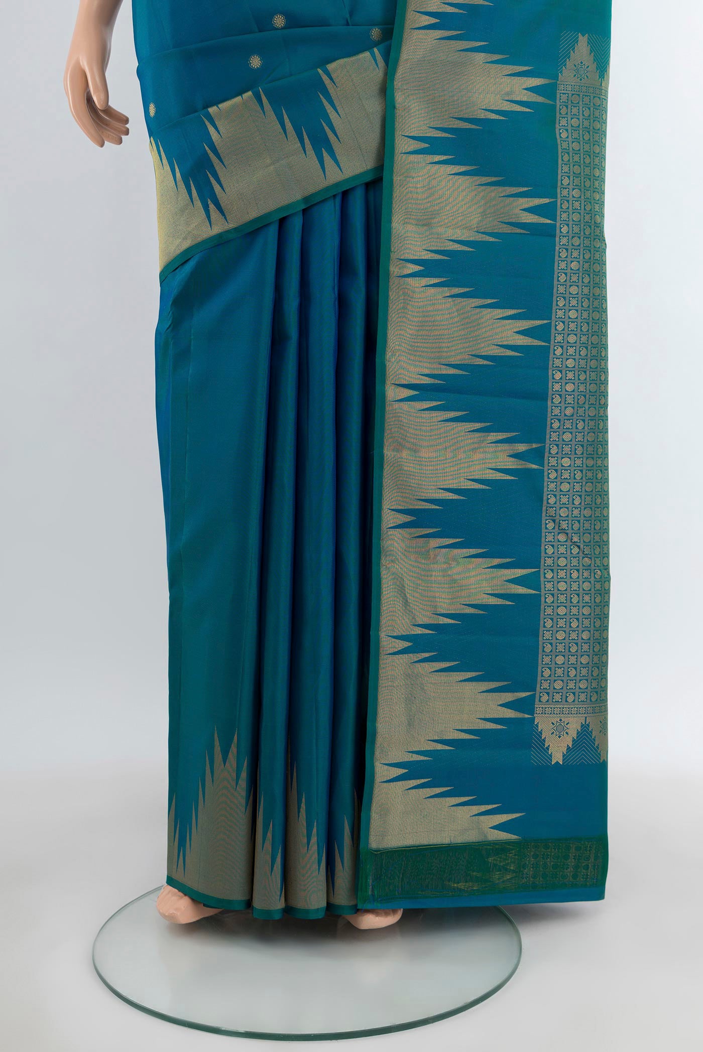 Pleats and pallu of Peacock Blue Kanchipuram Silk Saree with Zari Butta on the body and Temple Border. 
