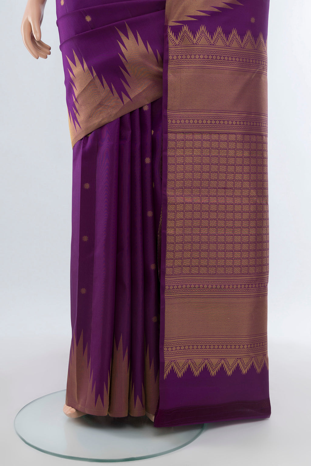 Pleats and pallu of Pure Silk Pure Zari Violet Kanchipuram Saree with Zari Butta on the body and Silk Border. 