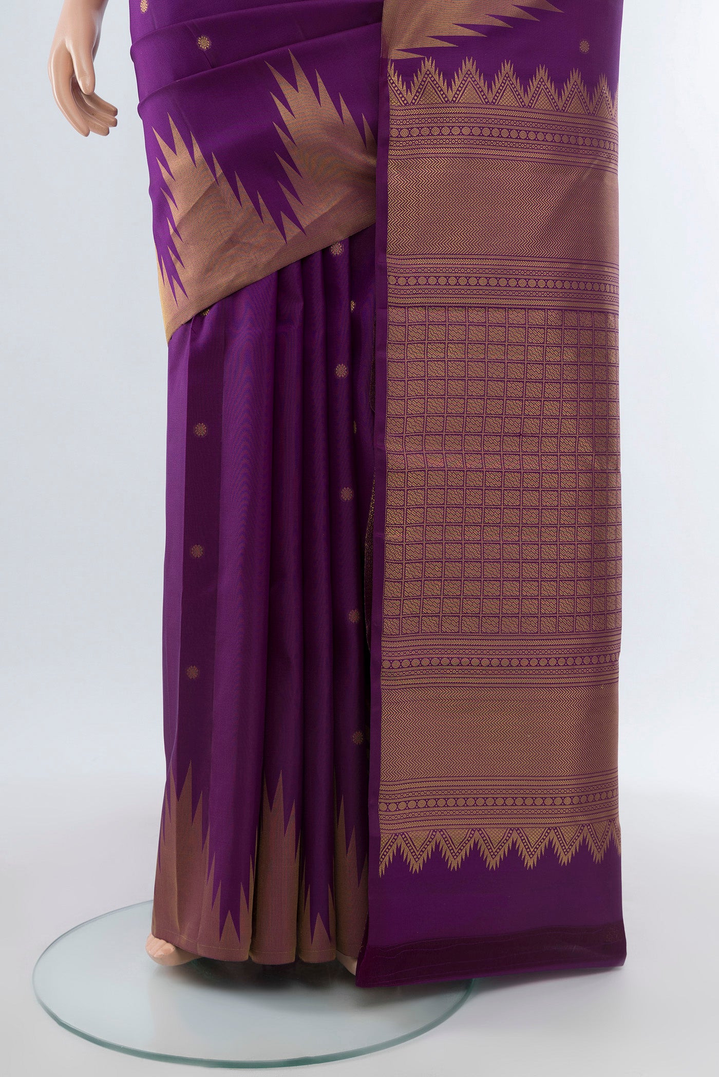 Pleats and pallu of Pure Silk Pure Zari Violet Kanchipuram Saree with Zari Butta on the body and Silk Border. 