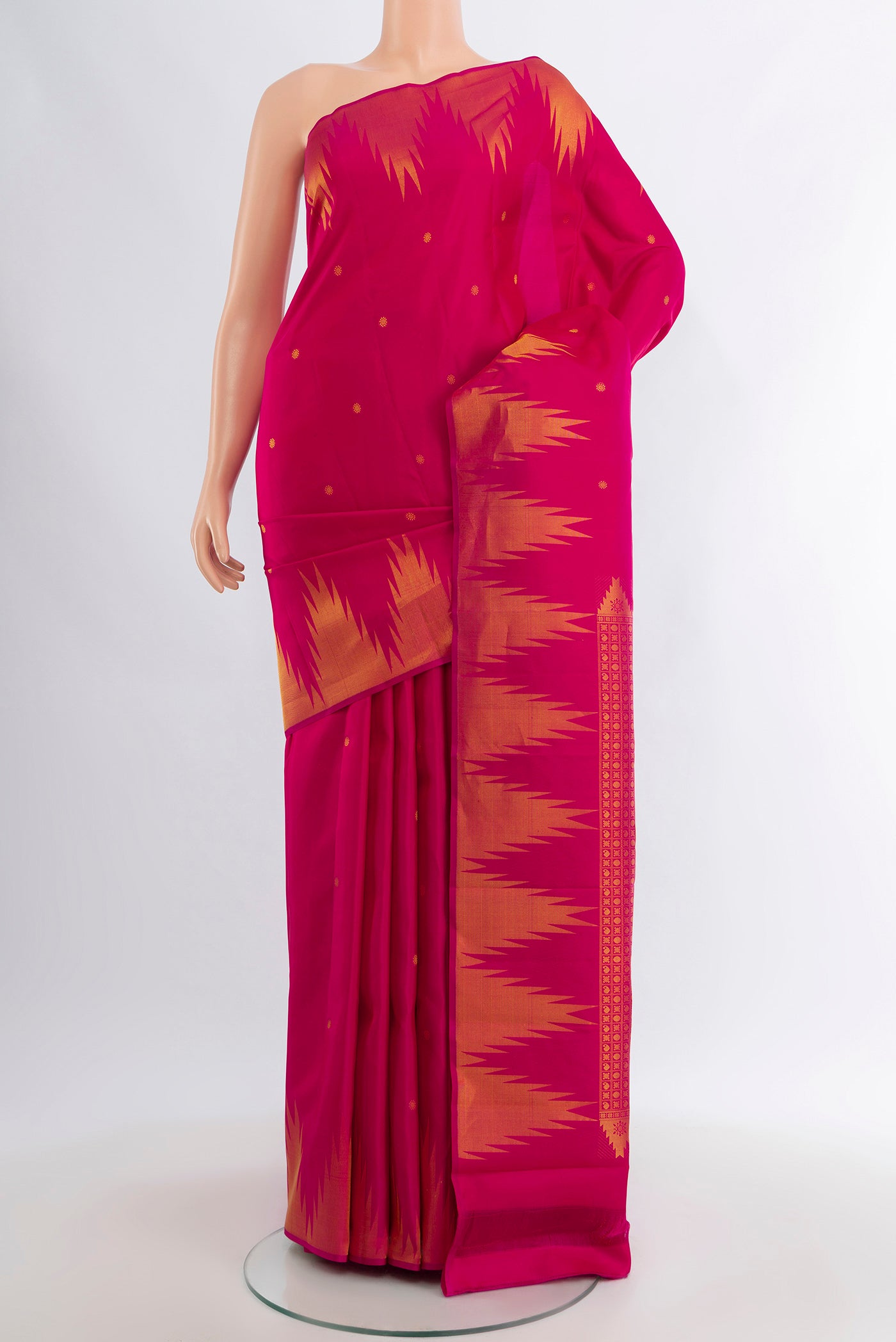 Pink Kanchipuram Silk Saree with Zari Butta on the body and Temple Border.  displayed on a mannequin