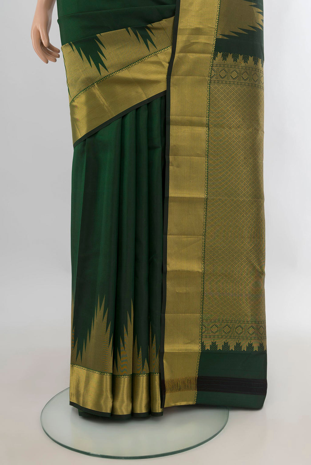 Pleats and pallu of Pure Silk Bottle Green Kanchipuram Saree with Plain Body and Temple Border. 