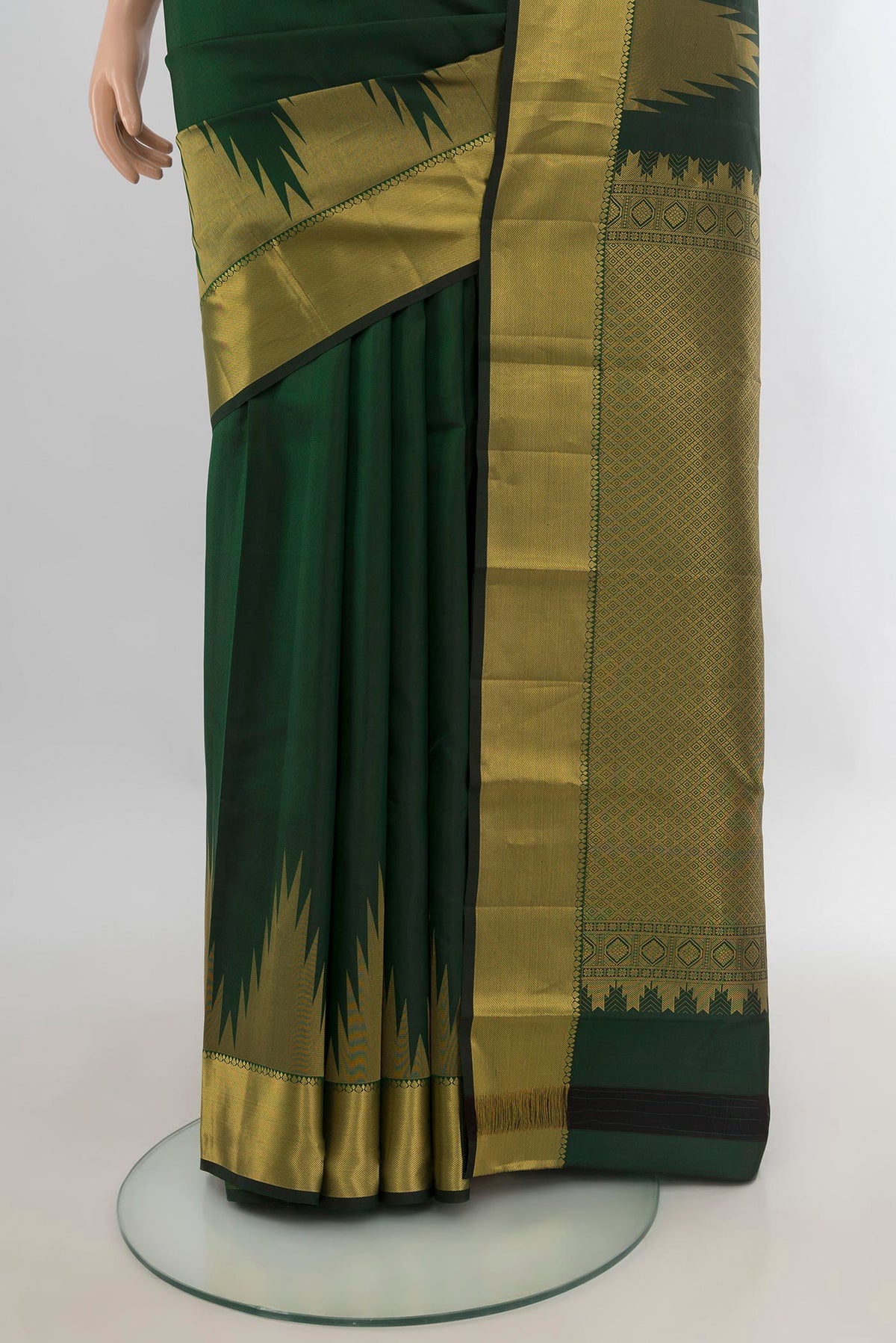 Pleats and pallu of Pure Silk Bottle Green Kanchipuram Saree with Plain Body and Temple Border. 
