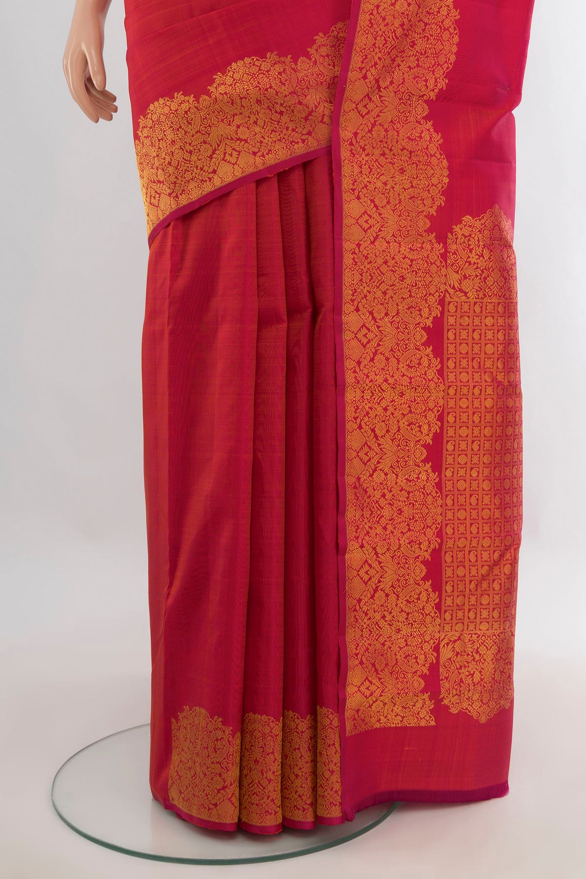 Pleats and pallu of Pure Silk Imperial Red Kanchipuram Saree with Zari Butta on the body and Fancy Border. 
