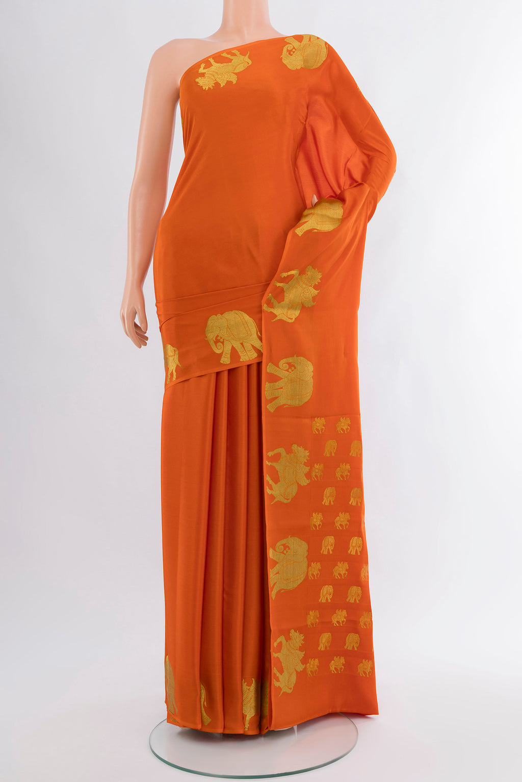 Orange Mysore Crepe Saree with Plain Body and Zari Border.  displayed on a mannequin