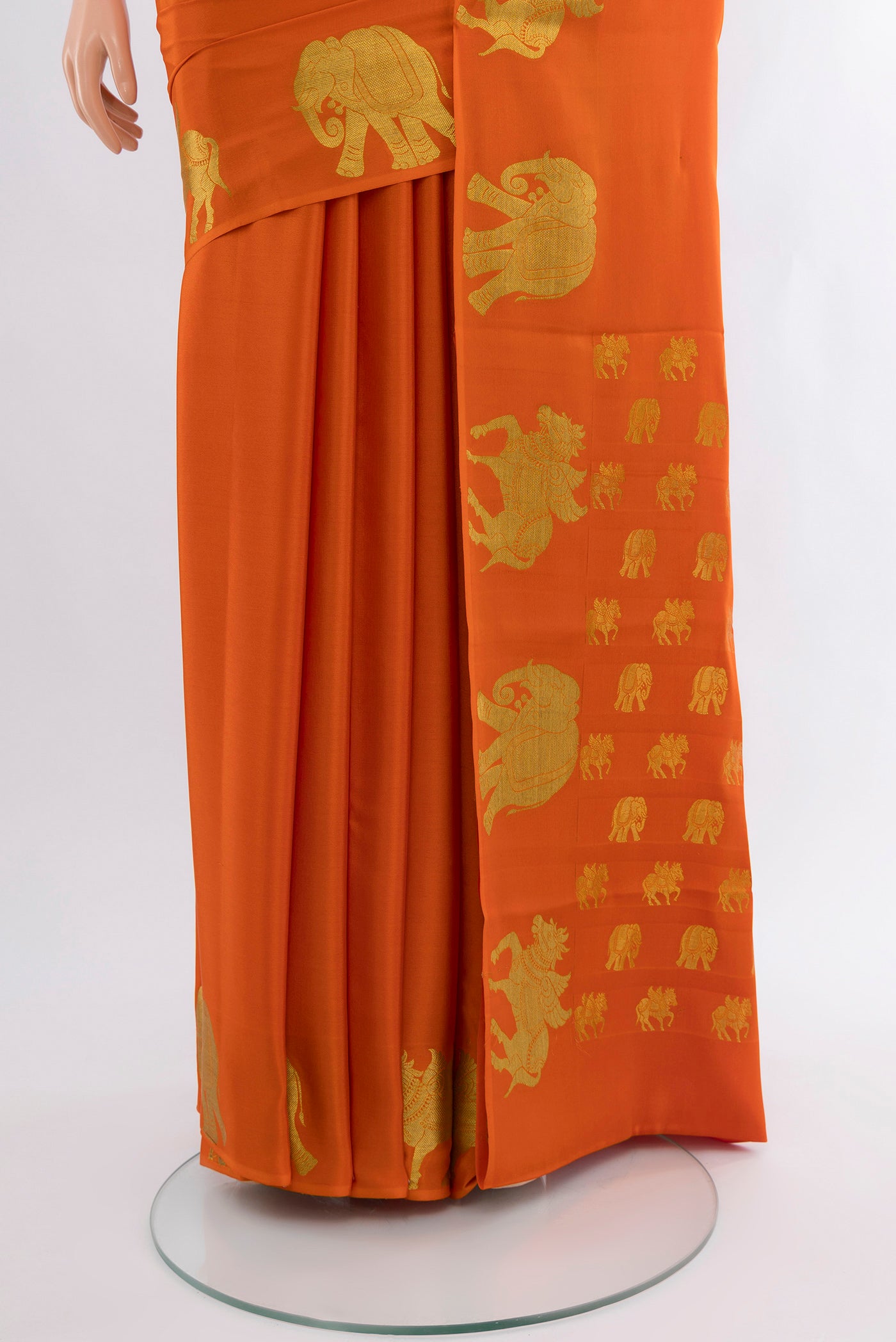 Pleats and pallu of Orange Mysore Crepe Saree with Plain Body and Zari Border. 