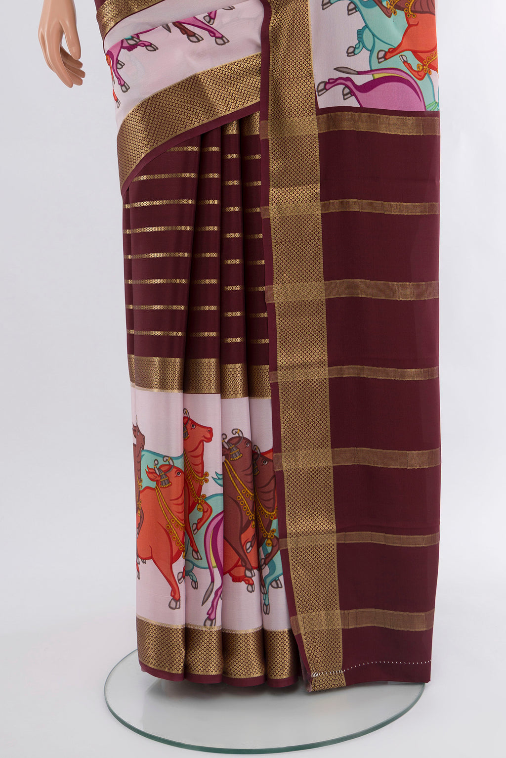 Pleats and pallu of Coffee Brown Mysore Crepe Saree with Stripes on the body and Zari Border. 