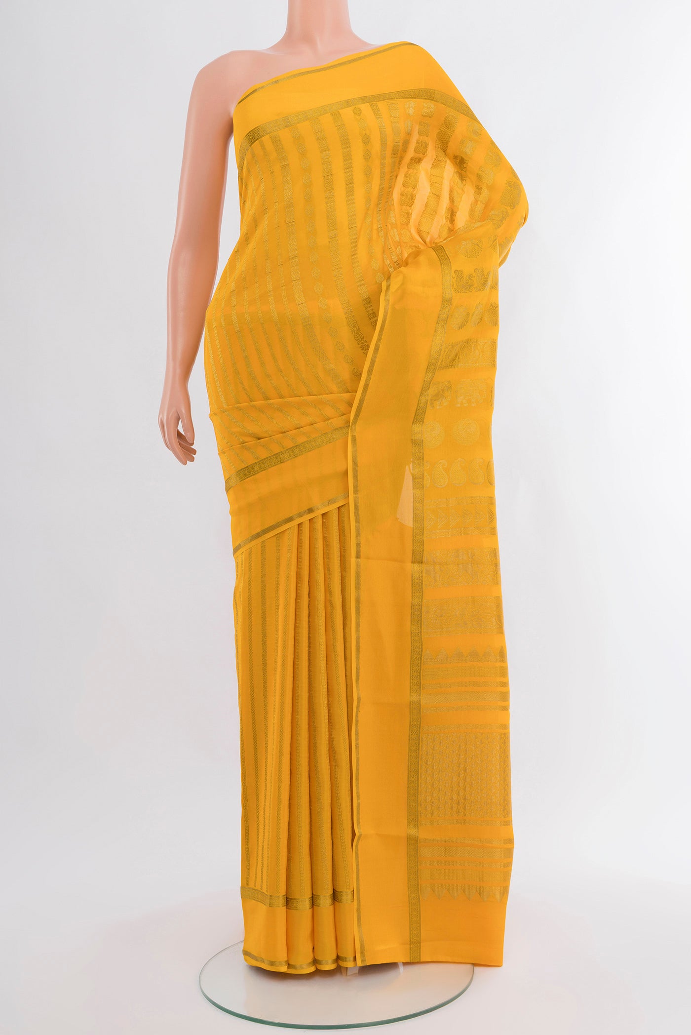 Yellow Mysore Crepe Saree with Stripes on the body and Zari Border.  displayed on a mannequin