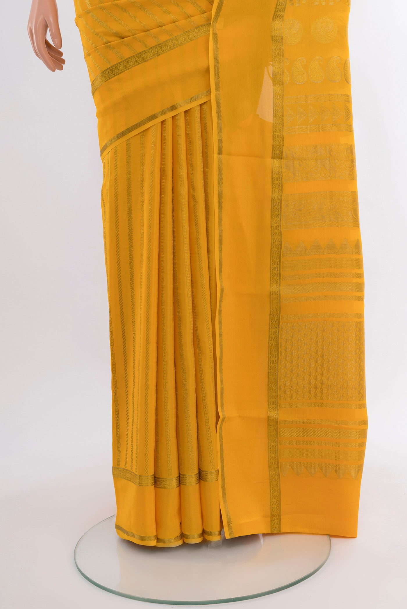 Pleats and pallu of Yellow Mysore Crepe Saree with Stripes on the body and Zari Border. 