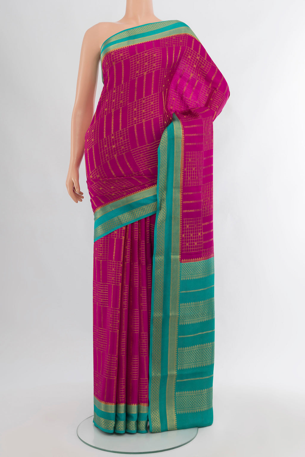 Magenta Mysore Crepe Saree with Zari Butta on the body and Zari Border.  displayed on a mannequin