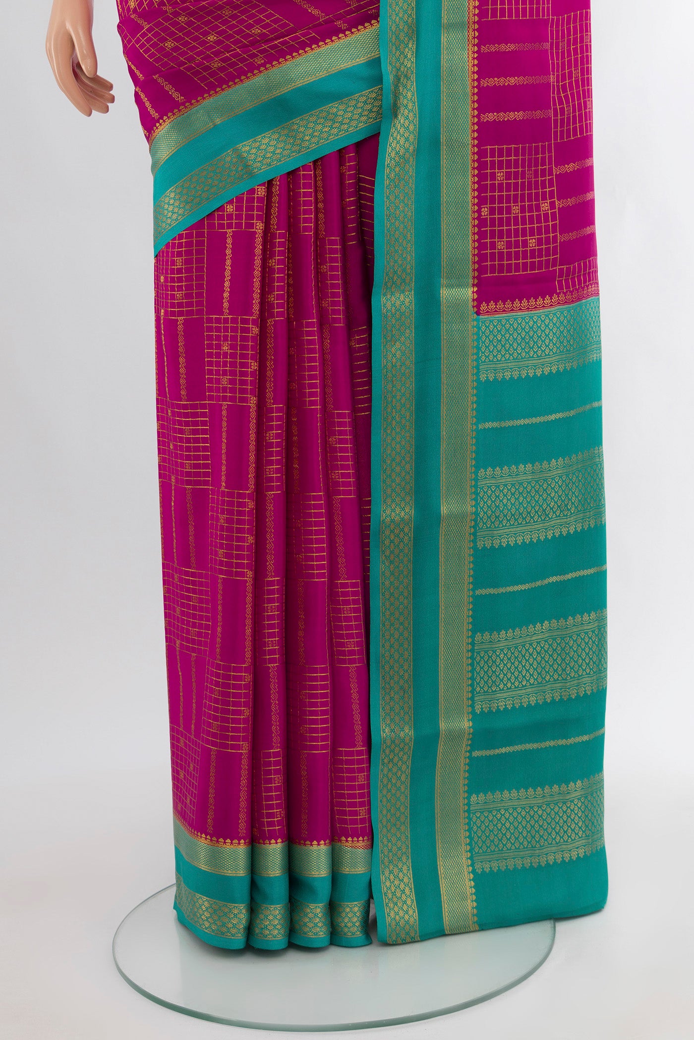 Pleats and pallu of Magenta Mysore Crepe Saree with Zari Butta on the body and Zari Border. 
