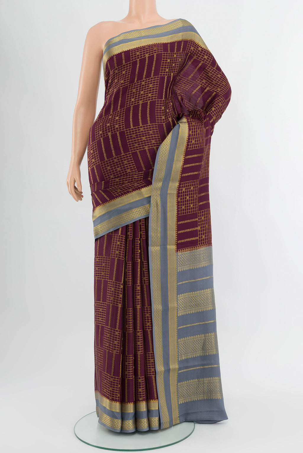 Coffee Brown Mysore Crepe Saree with Checked design on the body and Zari Border.  displayed on a mannequin