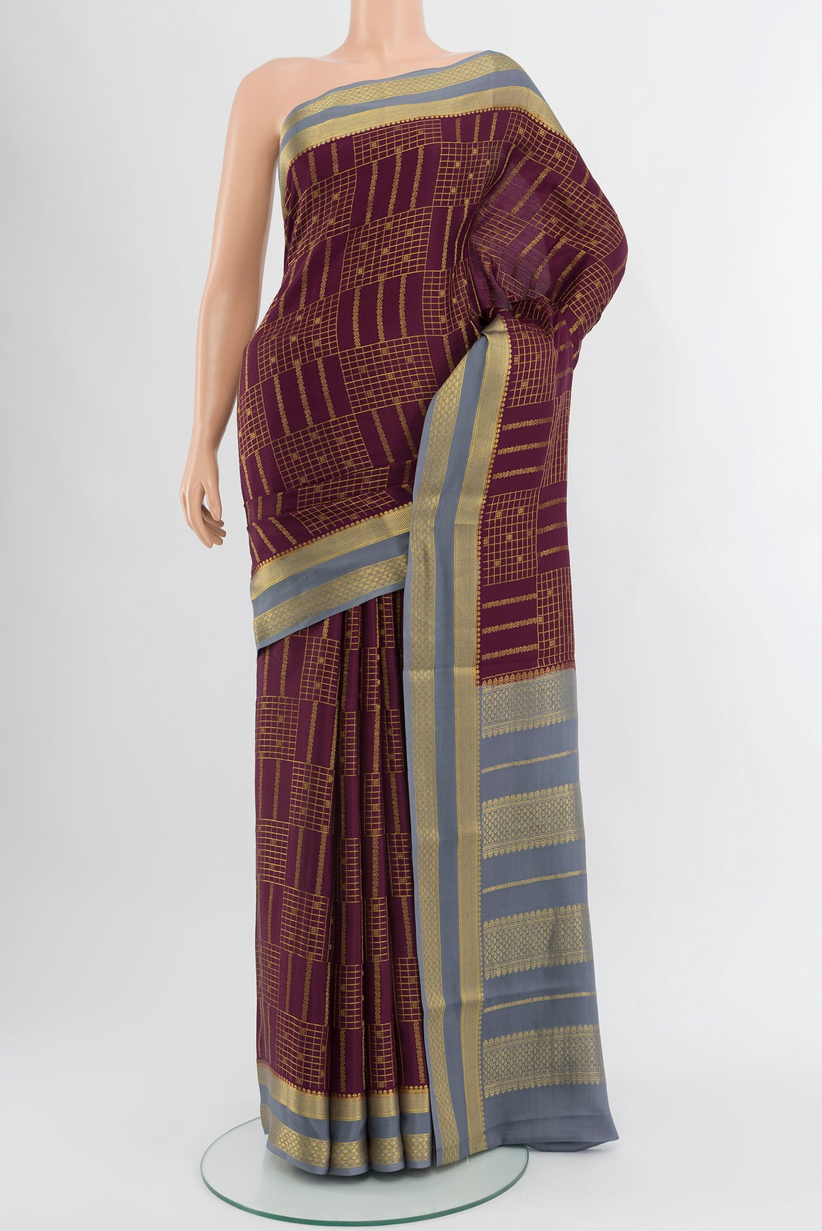Coffee Brown Mysore Crepe Saree with Checked design on the body and Zari Border.  displayed on a mannequin